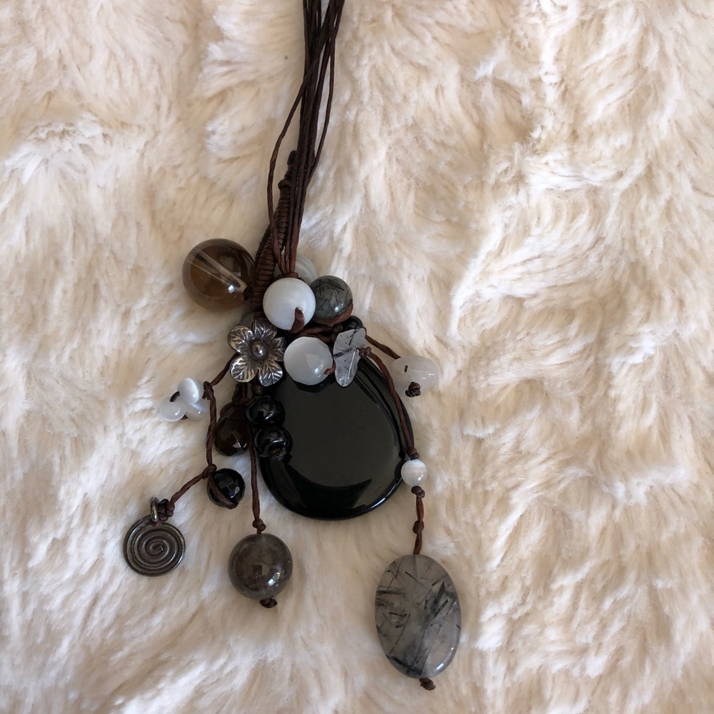 Whimsical multi strand necklace .